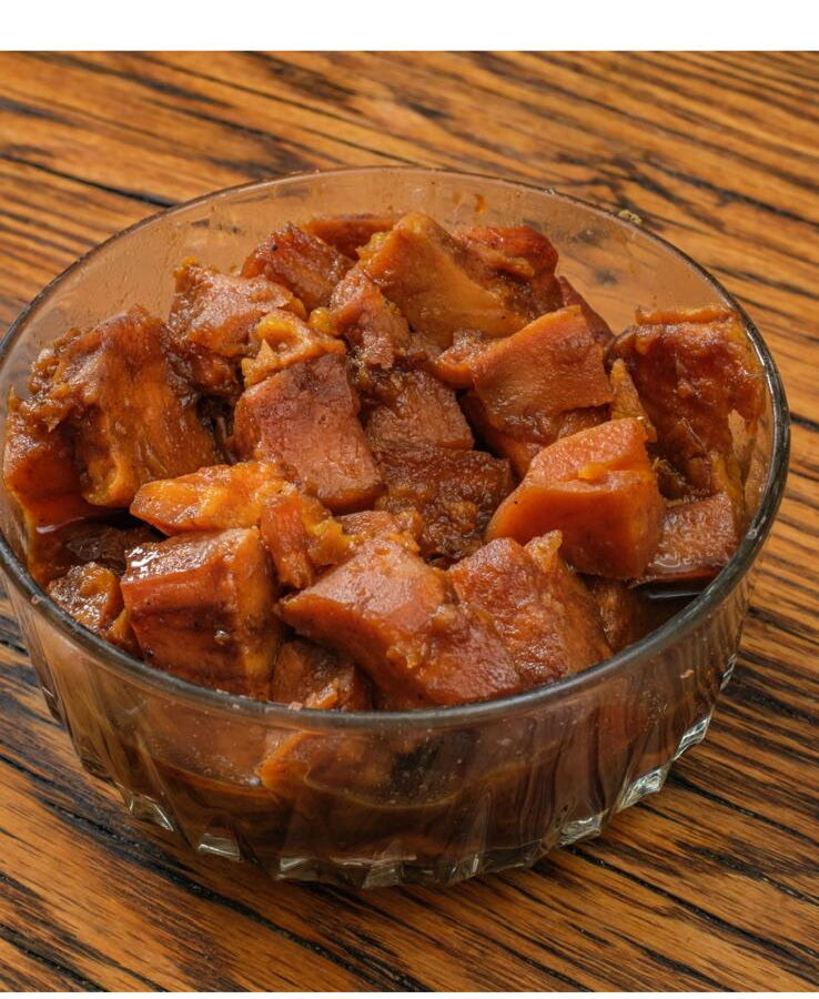 Sweet candied yams in a glass bowl