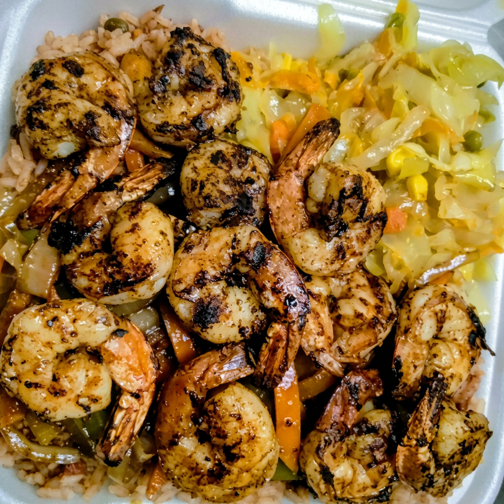 Jerk shrimp with rice and steamed cabbage
